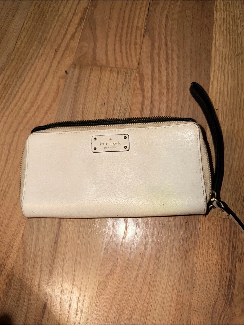 kate spade cream wristlet wallet with black strap